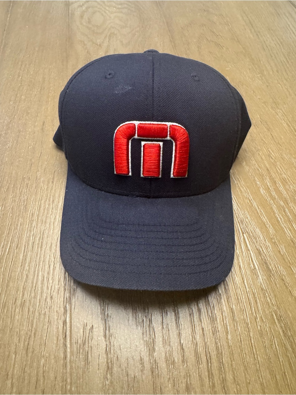 Travis Mathew Navy Hat with Red Logo